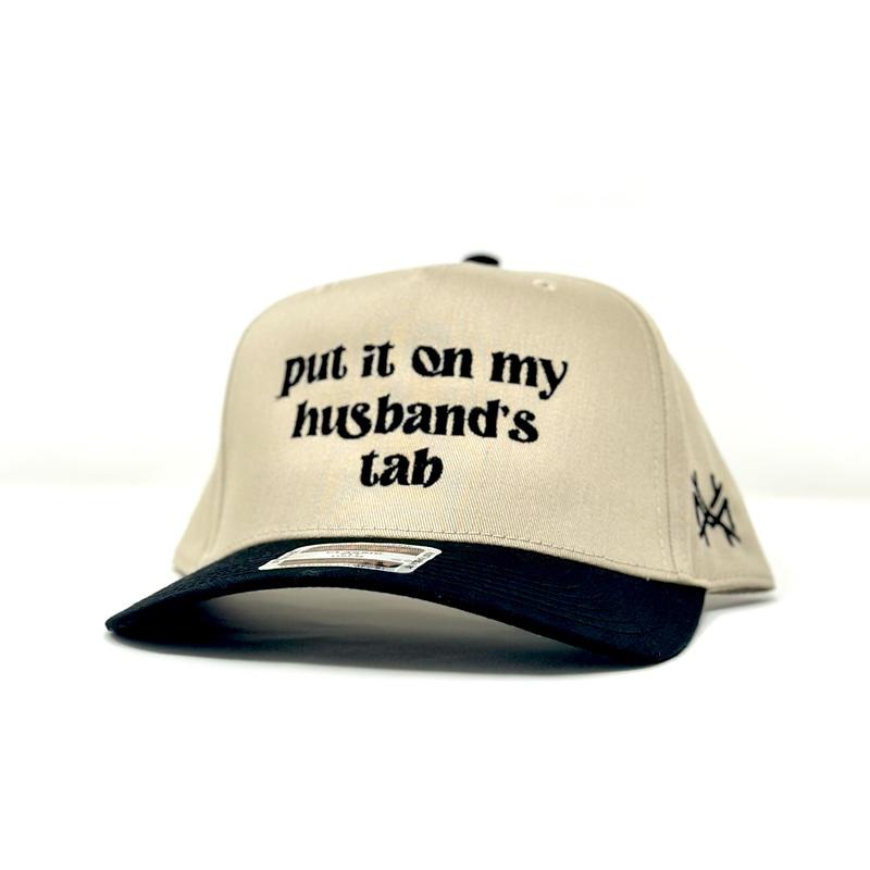 Put it on my Husband's Tab Trucker Hat by The Mad Hatter Company