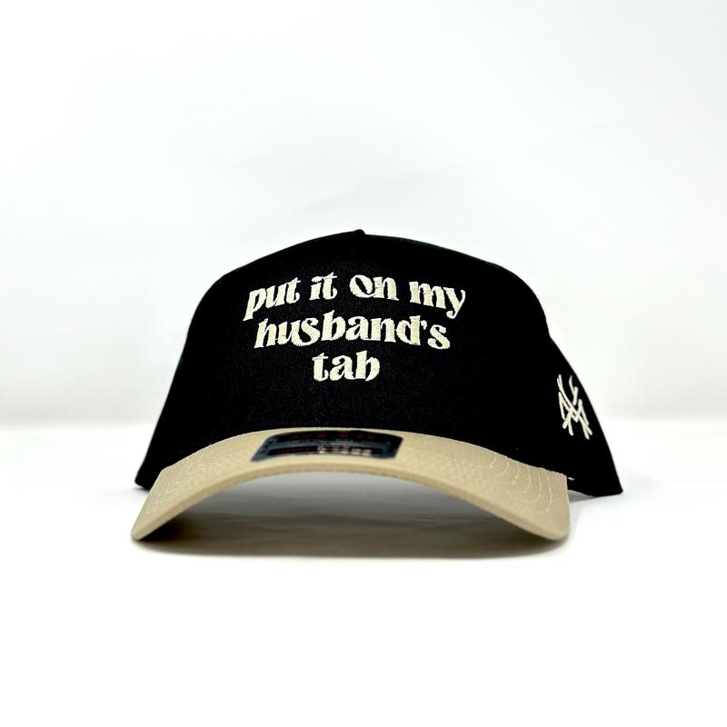 Put it on my Husband's Tab Trucker Hat by The Mad Hatter Company