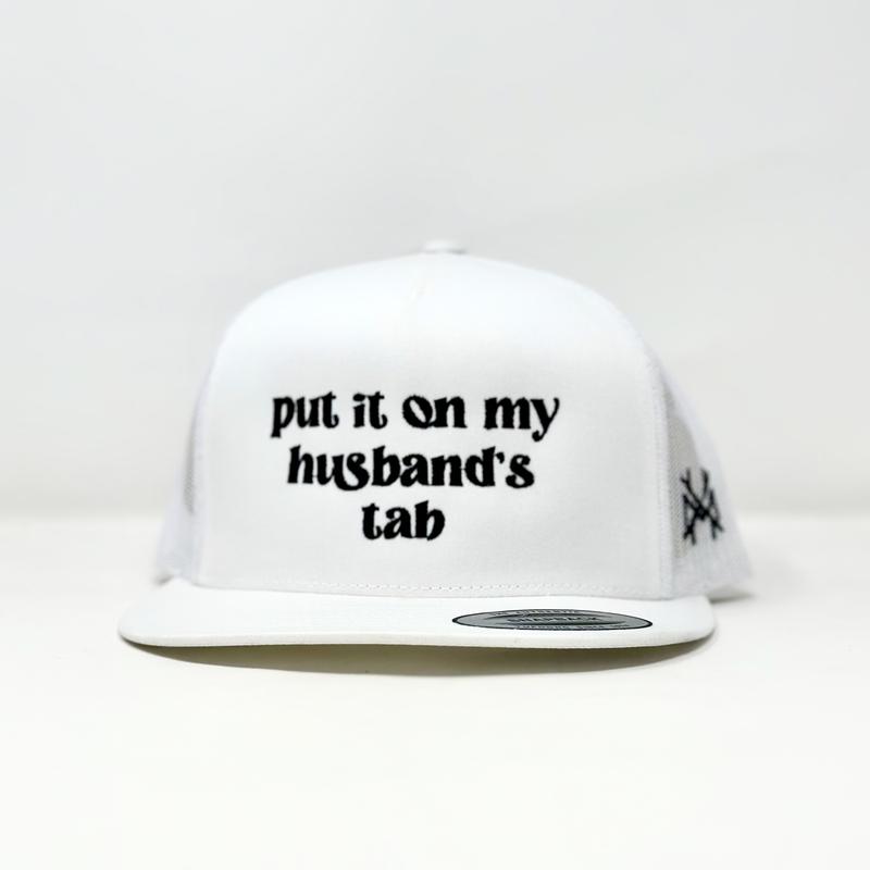 Put it on my Husband's Tab Trucker Hat by The Mad Hatter Company