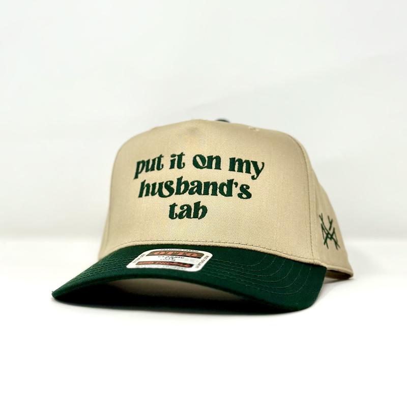 Put it on my Husband's Tab Trucker Hat by The Mad Hatter Company