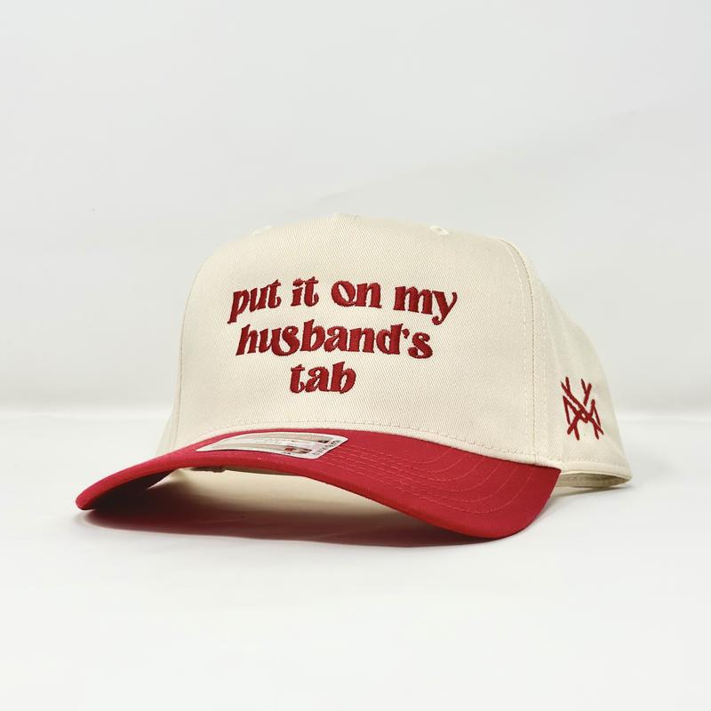 Put it on my Husband's Tab Trucker Hat by The Mad Hatter Company