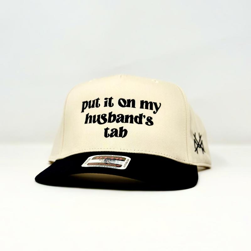 Put it on my Husband's Tab Trucker Hat by The Mad Hatter Company