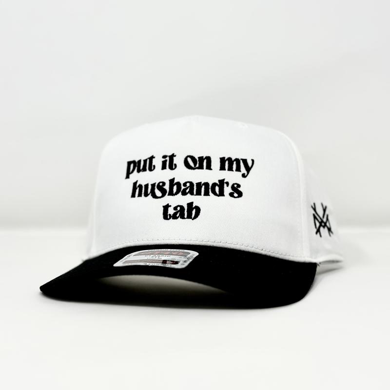 Put it on my Husband's Tab Trucker Hat by The Mad Hatter Company