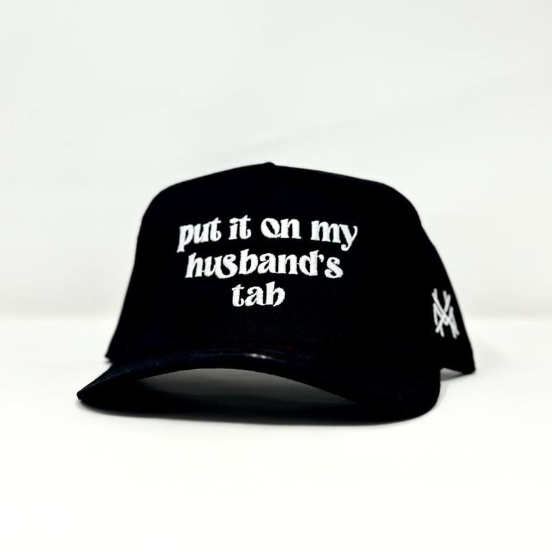 Put it on my Husband's Tab Trucker Hat by The Mad Hatter Company