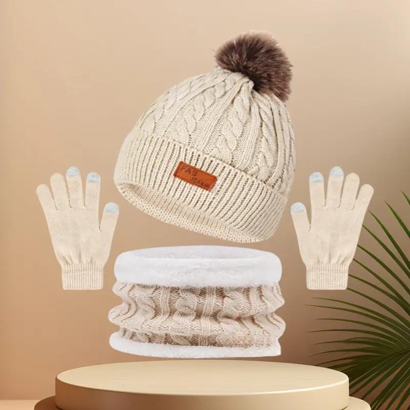 Winter Hats for women Festive winter knitted hat kit featuring pom - poms. This 3 - in - 1 warm set encompasses a thick hat, a cozy scarf, and touchscreen gloves. It's perfect for ladies during cold - day outings.