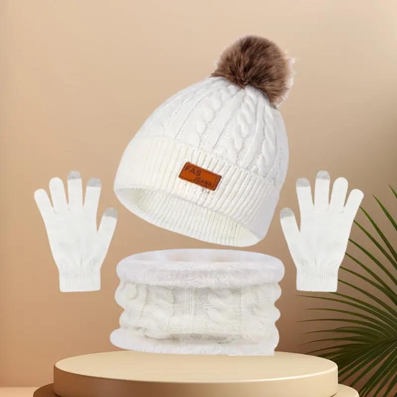 Winter Hats for women Festive winter knitted hat kit featuring pom - poms. This 3 - in - 1 warm set encompasses a thick hat, a cozy scarf, and touchscreen gloves. It's perfect for ladies during cold - day outings.